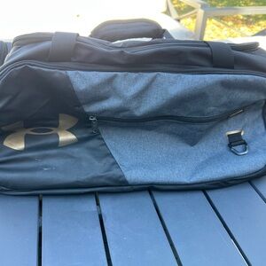 Under Armour Black and Gray Duffel Bag , Gold logo. Pre owned.